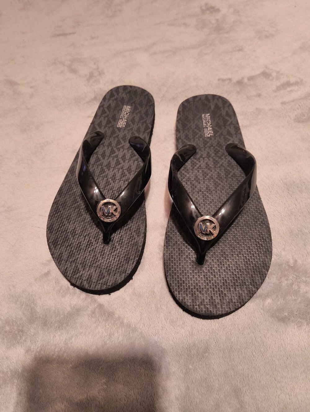 MK black flip flops size 7
